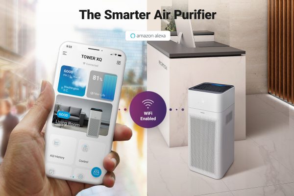 Winix smart app on smartphone being used while XQ air purifier is in an office