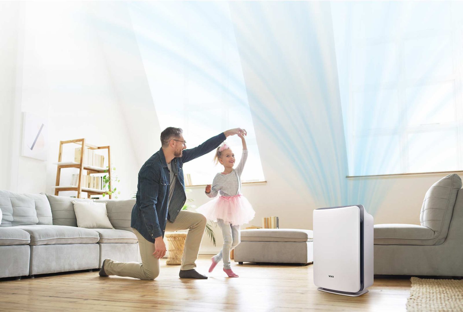 Father and daughter dancing in living room with D360