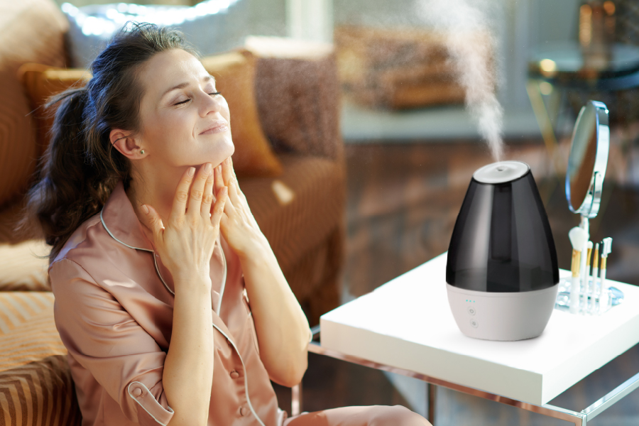 Woman enjoying L100 mist as part of her beauty regimen