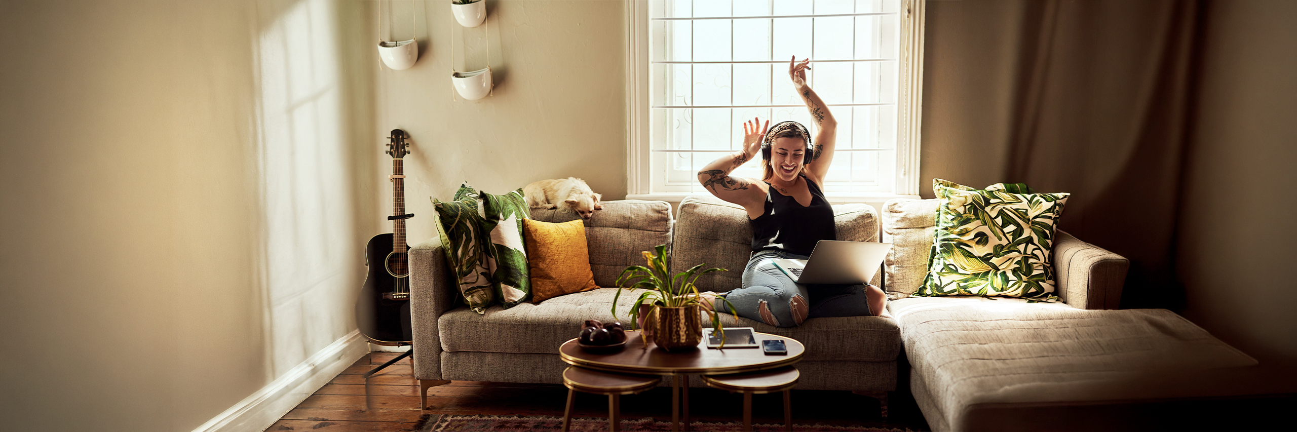 Woman listening to music on couch in livingroom 