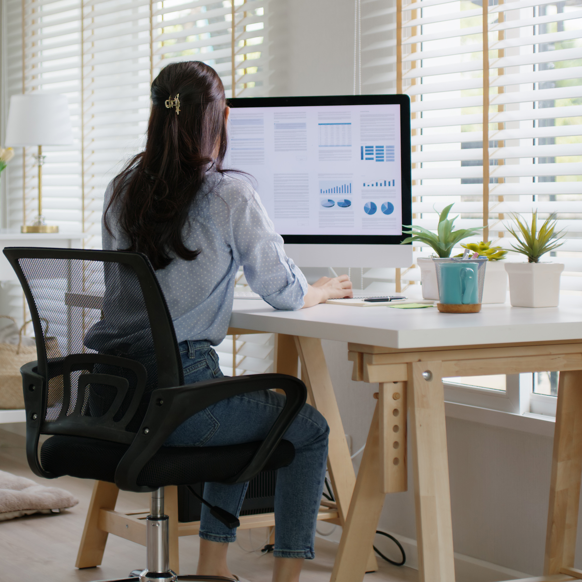 Woman at her desk working from home
